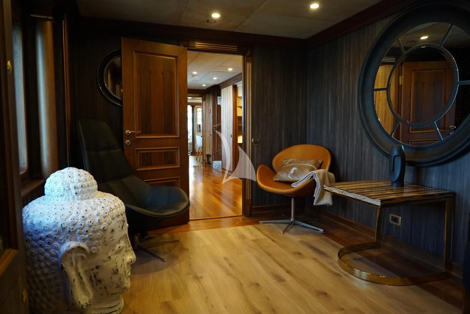 a room with a mirror and a chair in it aboard IRAMA Yacht for Sale