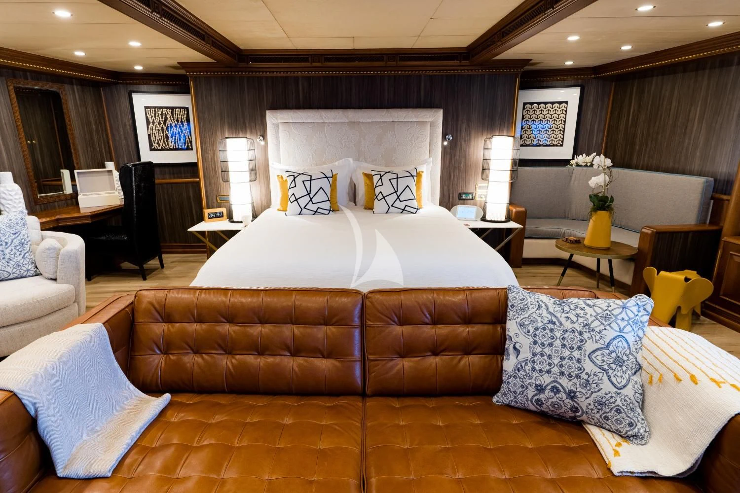 a large bed in a hotel room aboard IRAMA Yacht for Sale