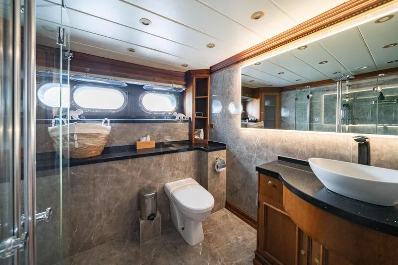 a bathroom with a glass shower aboard IRAMA Yacht for Sale