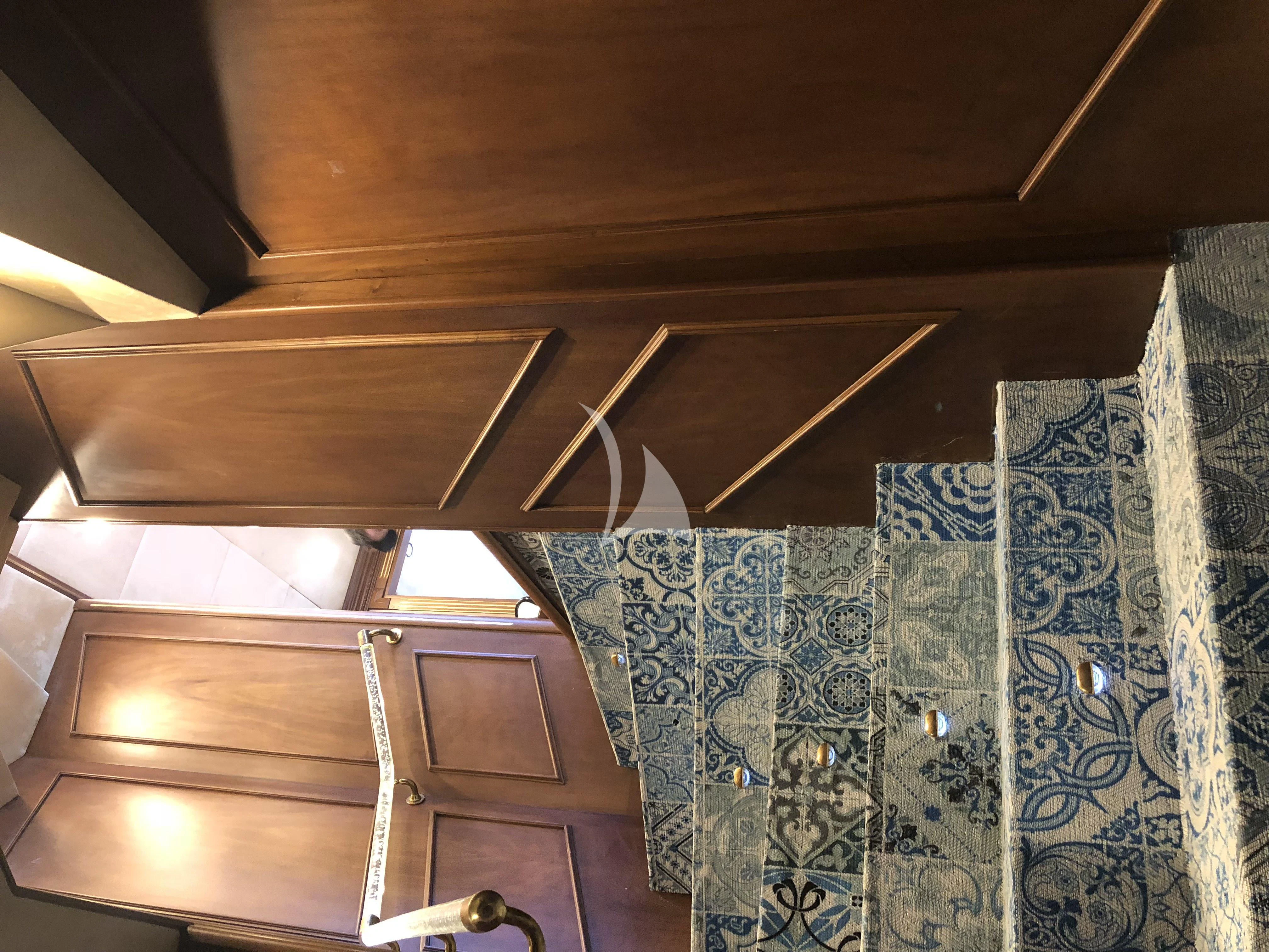 a room with a wood ceiling and a tile floor aboard IRAMA Yacht for Sale