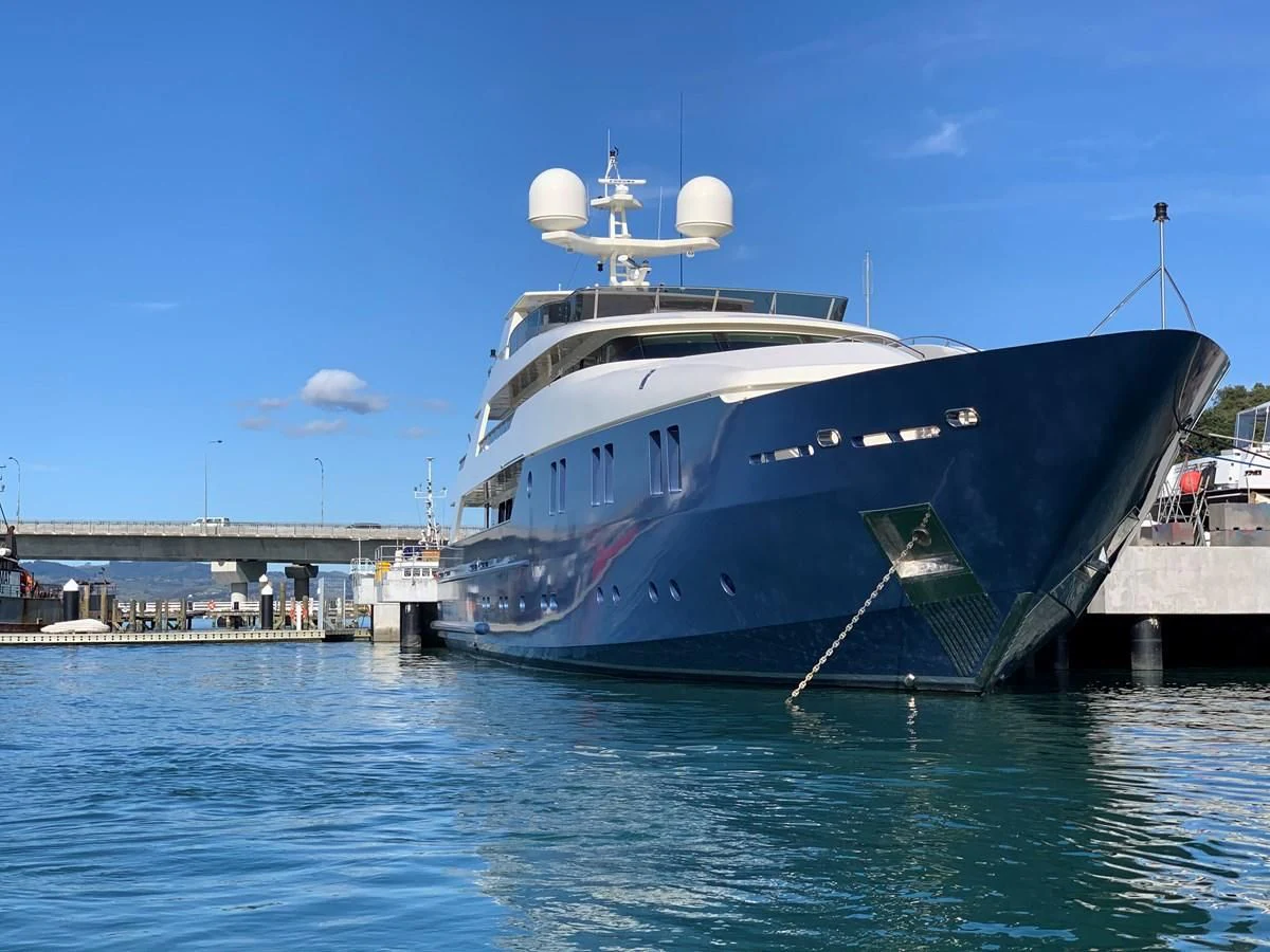 a large ship docked at a pier aboard IRAMA Yacht for Sale