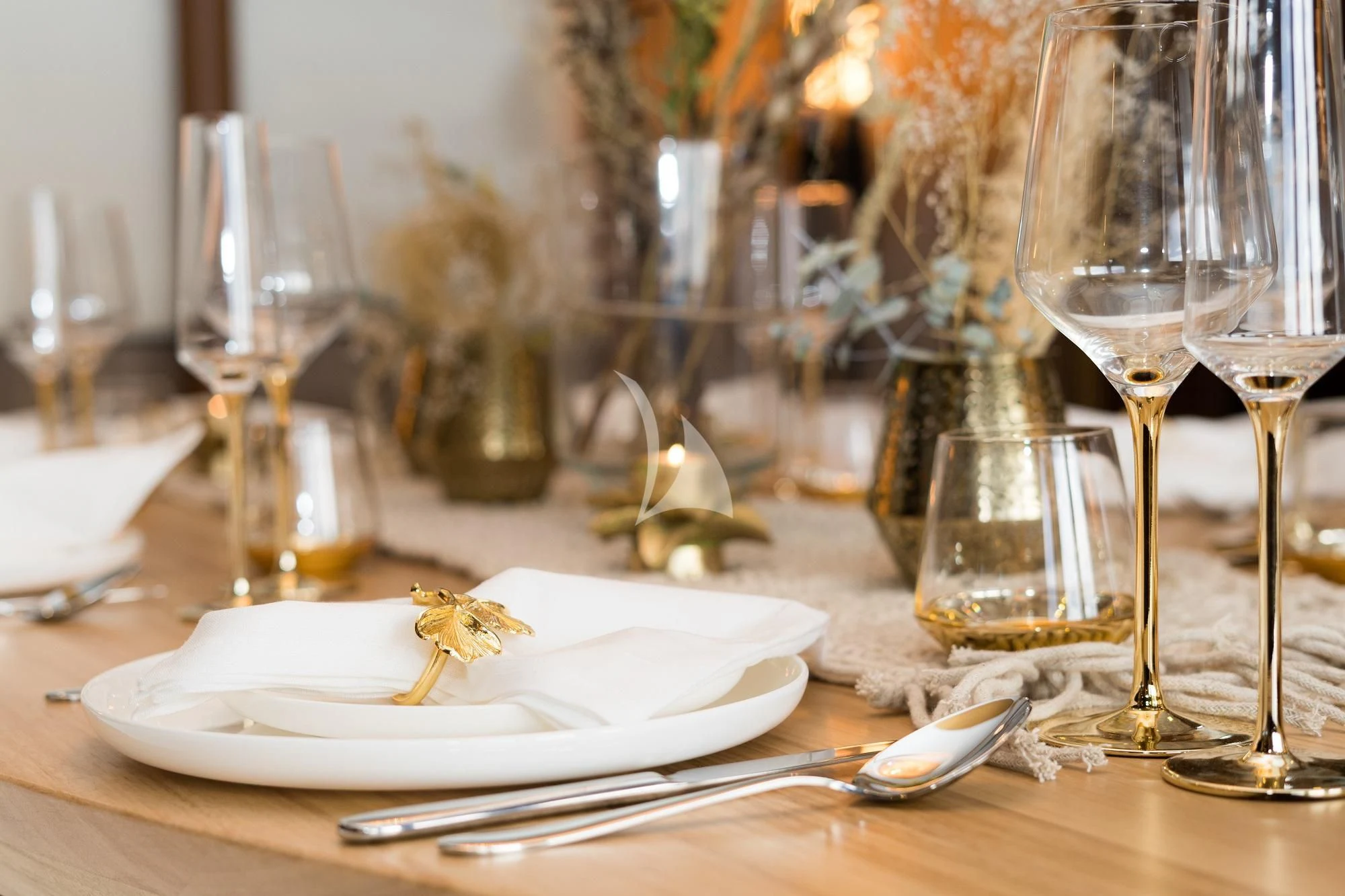 a table with plates and glasses aboard IRAMA Yacht for Sale