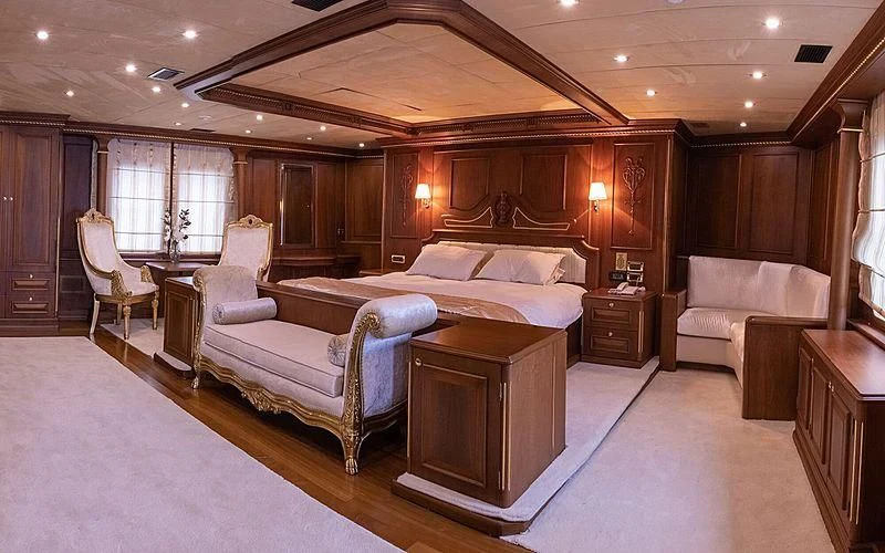 a large bedroom with a large bed aboard IRAMA Yacht for Sale