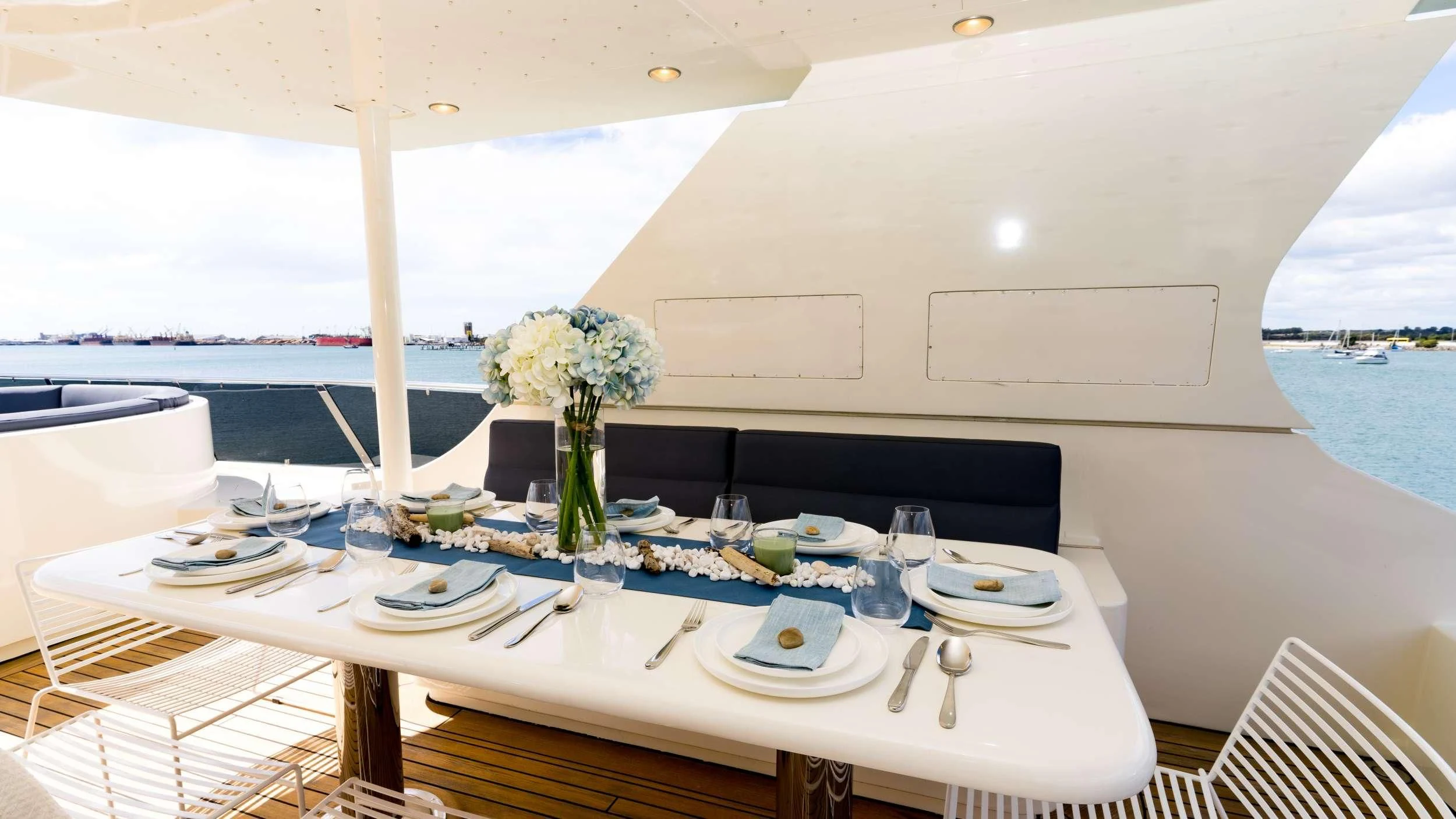 a table set for a dinner aboard IRAMA Yacht for Sale