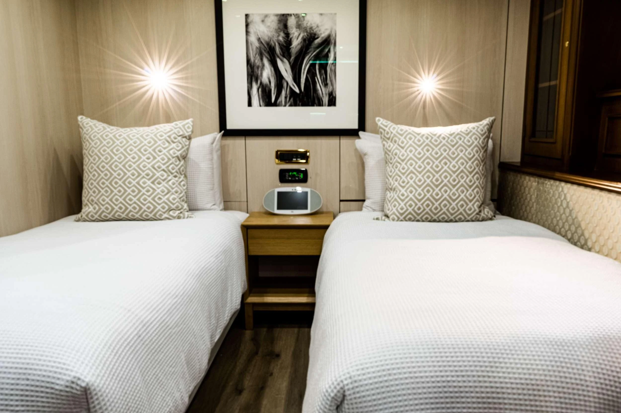 a couple of beds in a hotel room aboard IRAMA Yacht for Sale