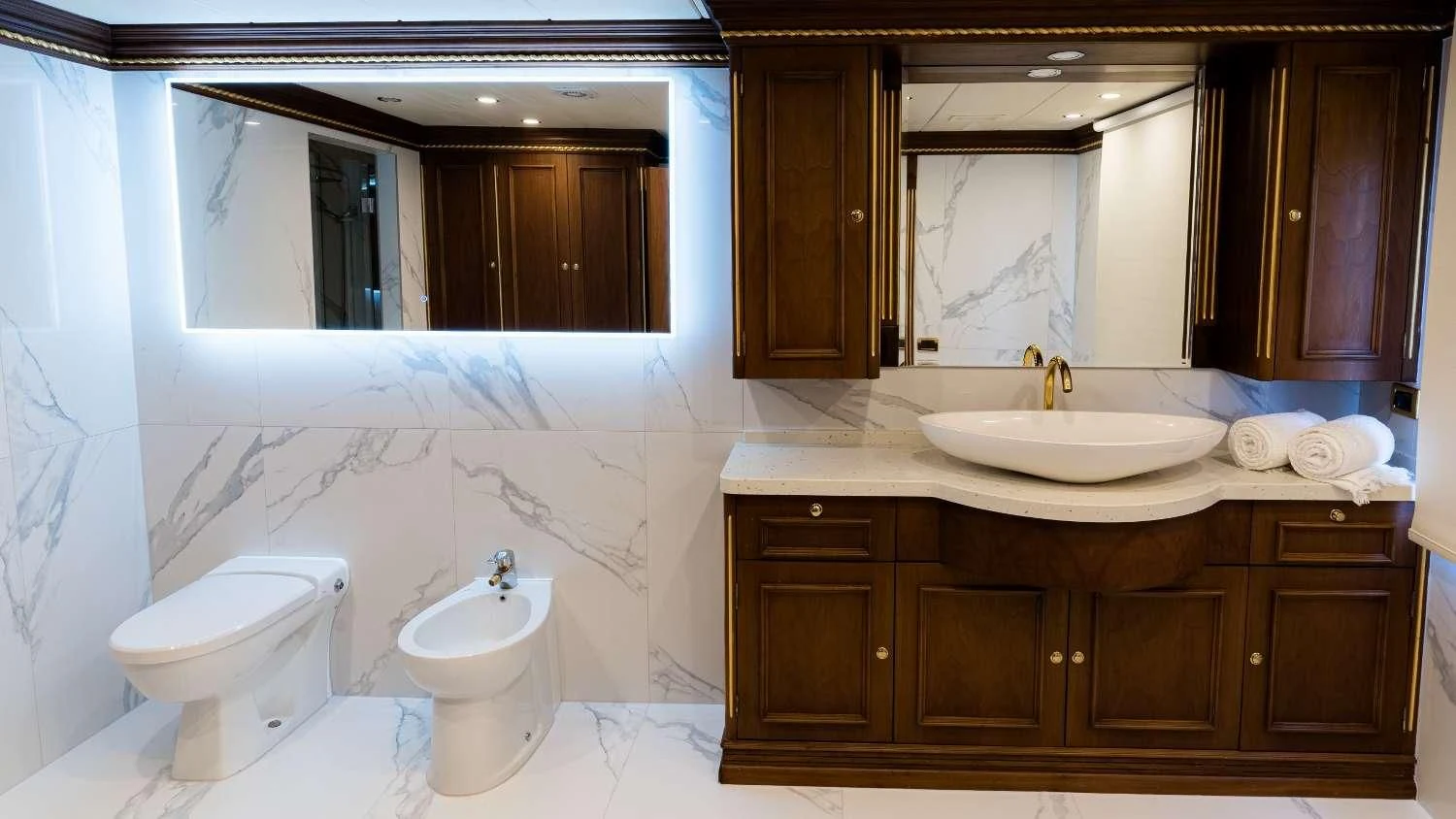 a bathroom with a sink and a toilet aboard IRAMA Yacht for Sale