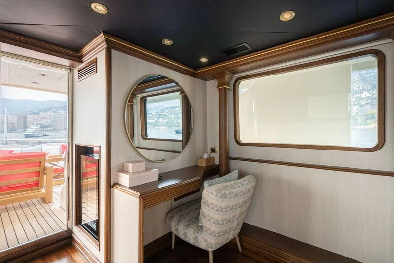 a room with a chair and a desk aboard IRAMA Yacht for Sale