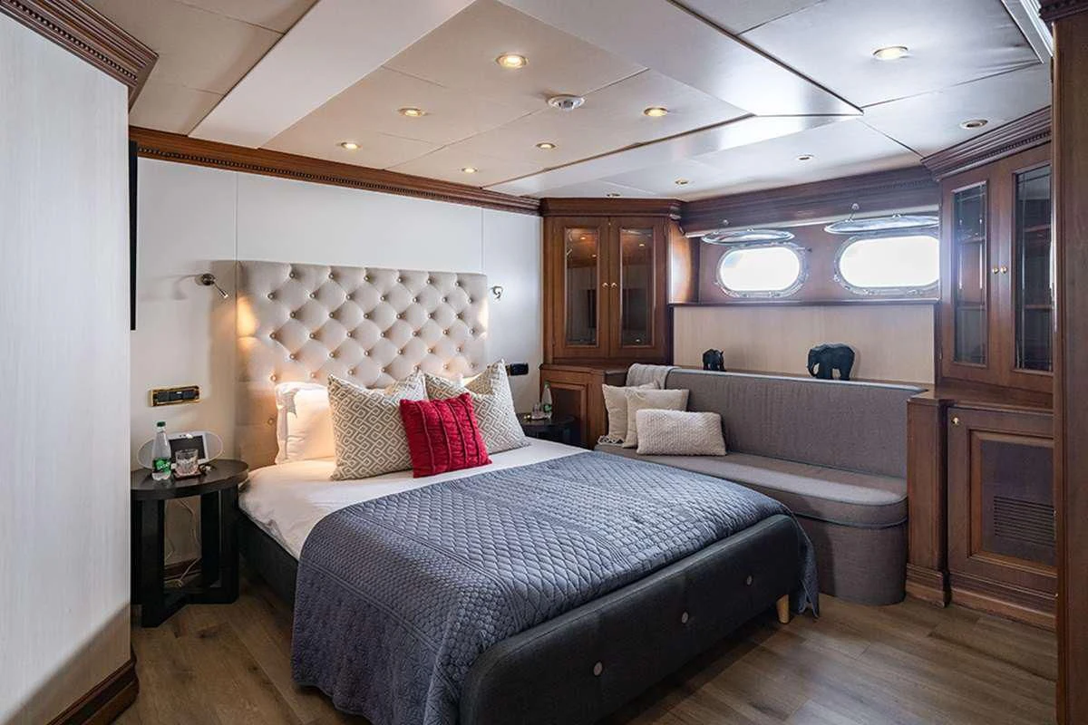 a room with two beds aboard IRAMA Yacht for Sale