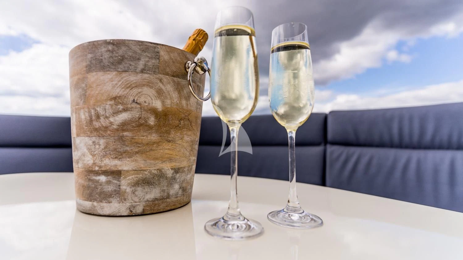 a group of champagne glasses aboard IRAMA Yacht for Sale