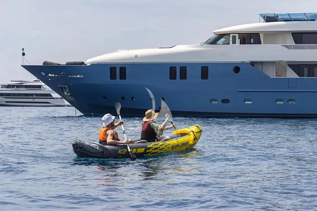 a group of people in a boat in the water aboard IRAMA Yacht for Sale