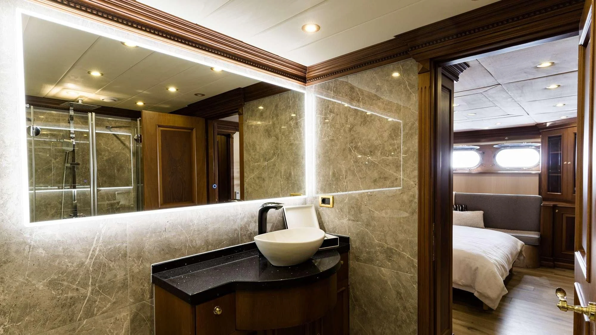 a bathroom with a sink and a mirror aboard IRAMA Yacht for Sale