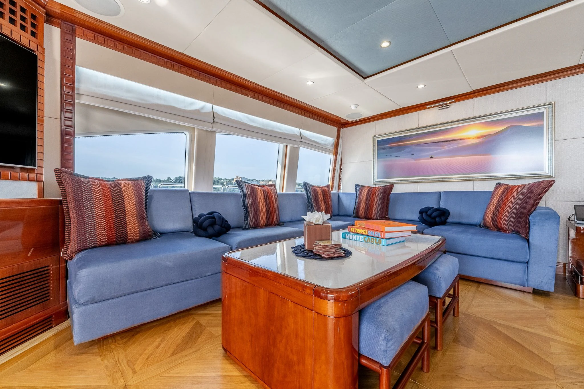 a living room with a couch and a coffee table aboard GRAND CRU Yacht for Sale