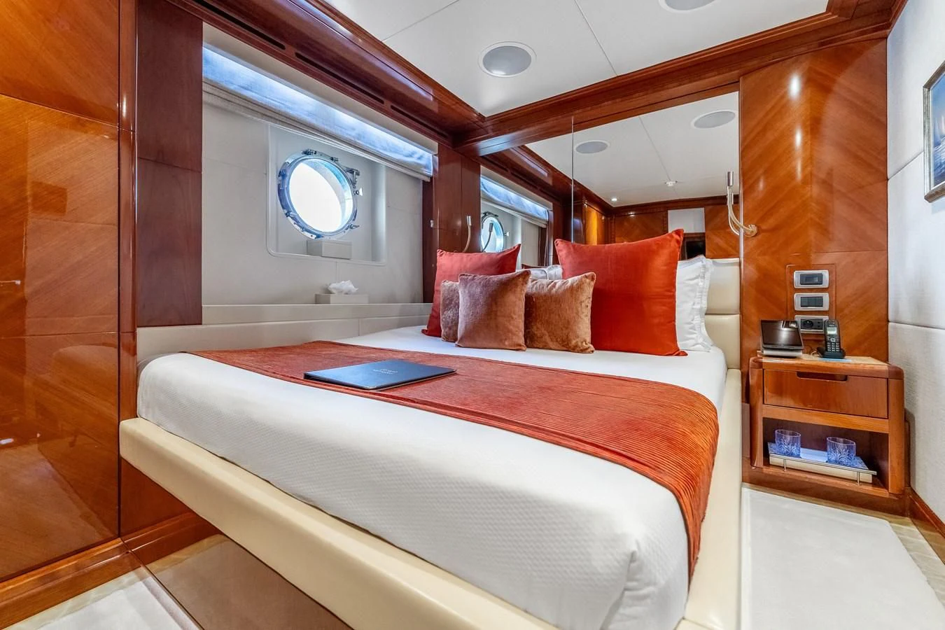 a bed with a red pillow aboard GRAND CRU Yacht for Sale
