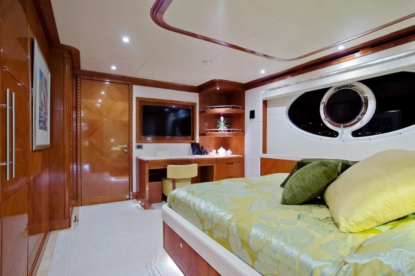 a bedroom with a bed and a television aboard GRAND CRU Yacht for Sale