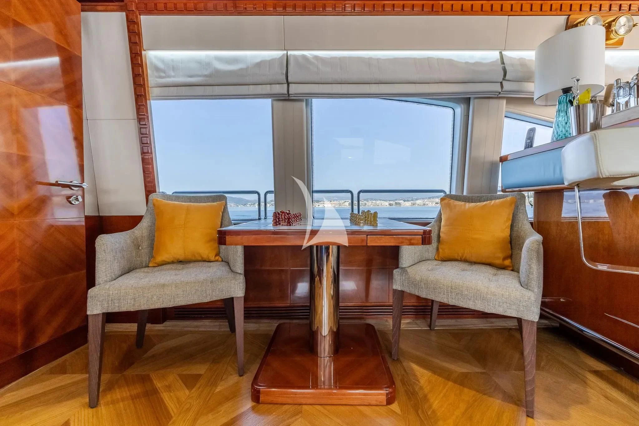a room with a table and chairs aboard GRAND CRU Yacht for Sale