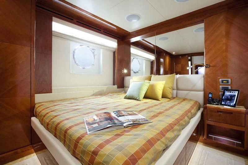 a bed with a mirror above it aboard GRAND CRU Yacht for Sale