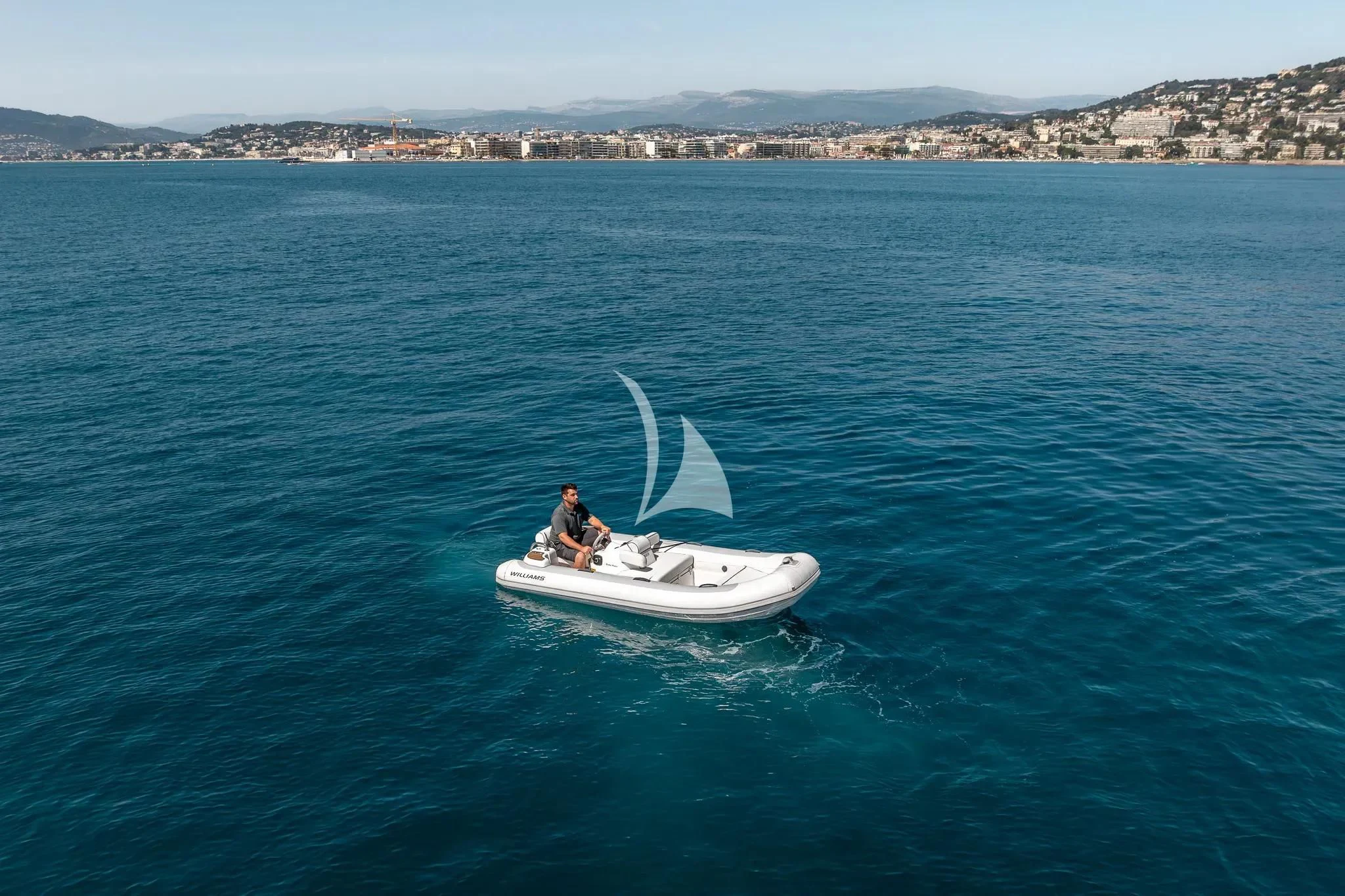 a man and a dog on a small white boat in the water aboard GRAND CRU Yacht for Sale