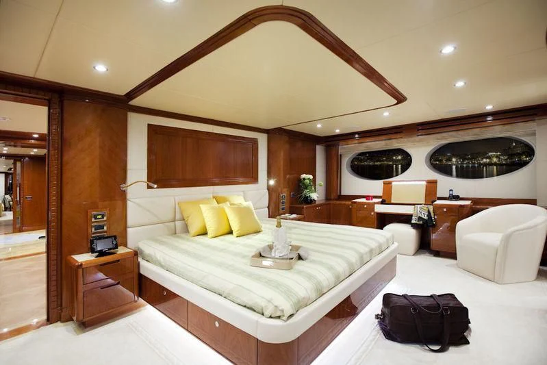 a large bedroom with a bed aboard GRAND CRU Yacht for Sale