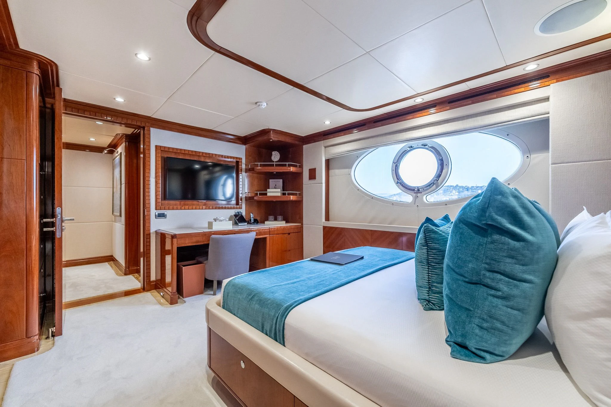 a bedroom with a bed and a desk aboard GRAND CRU Yacht for Sale
