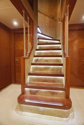 a set of stairs in a wooden house aboard GRAND CRU Yacht for Sale