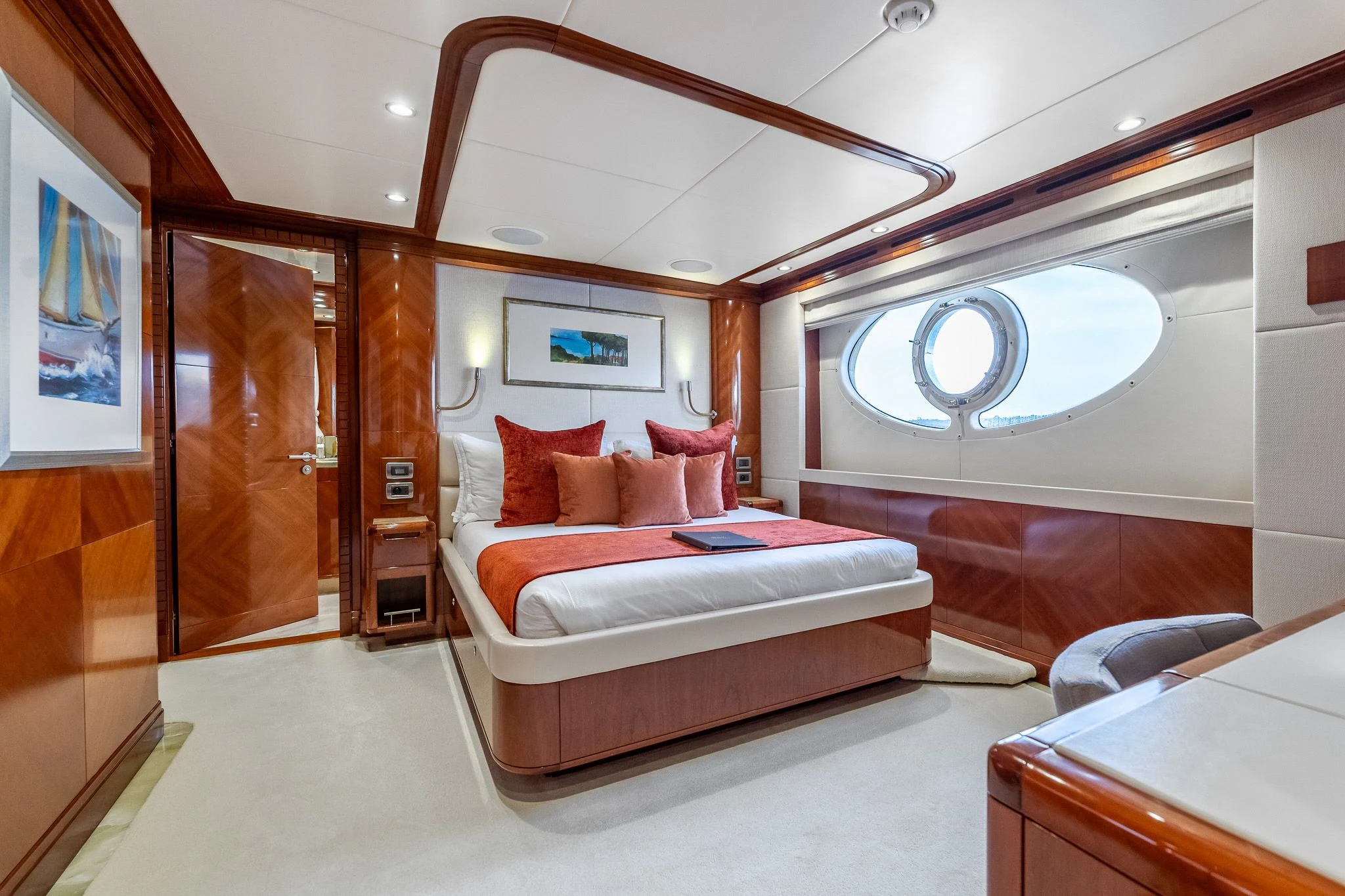 a room with a bed and a large mirror aboard GRAND CRU Yacht for Sale