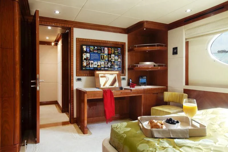 a room with a table and chairs aboard GRAND CRU Yacht for Sale