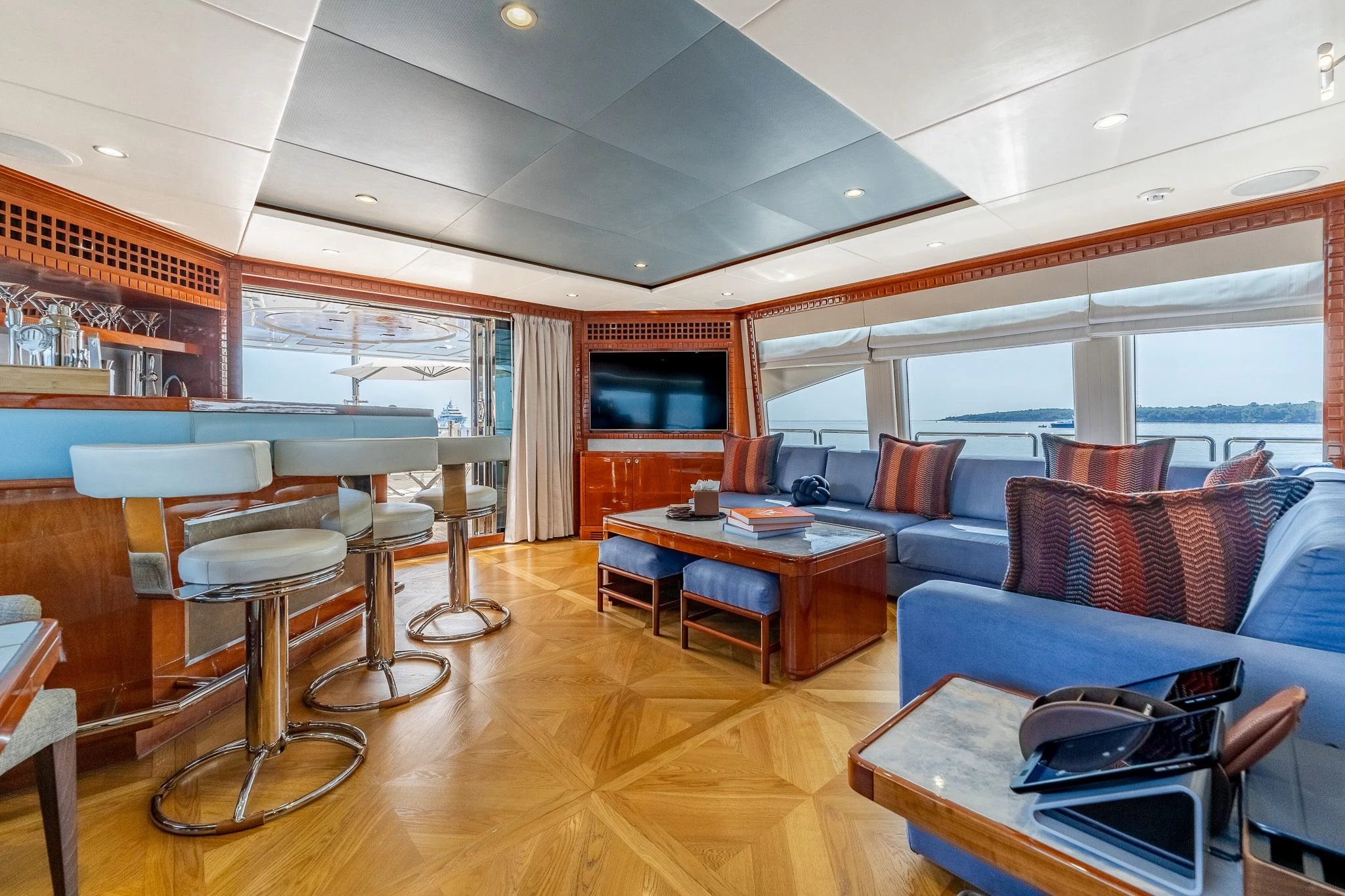 a living room with a wood floor aboard GRAND CRU Yacht for Sale