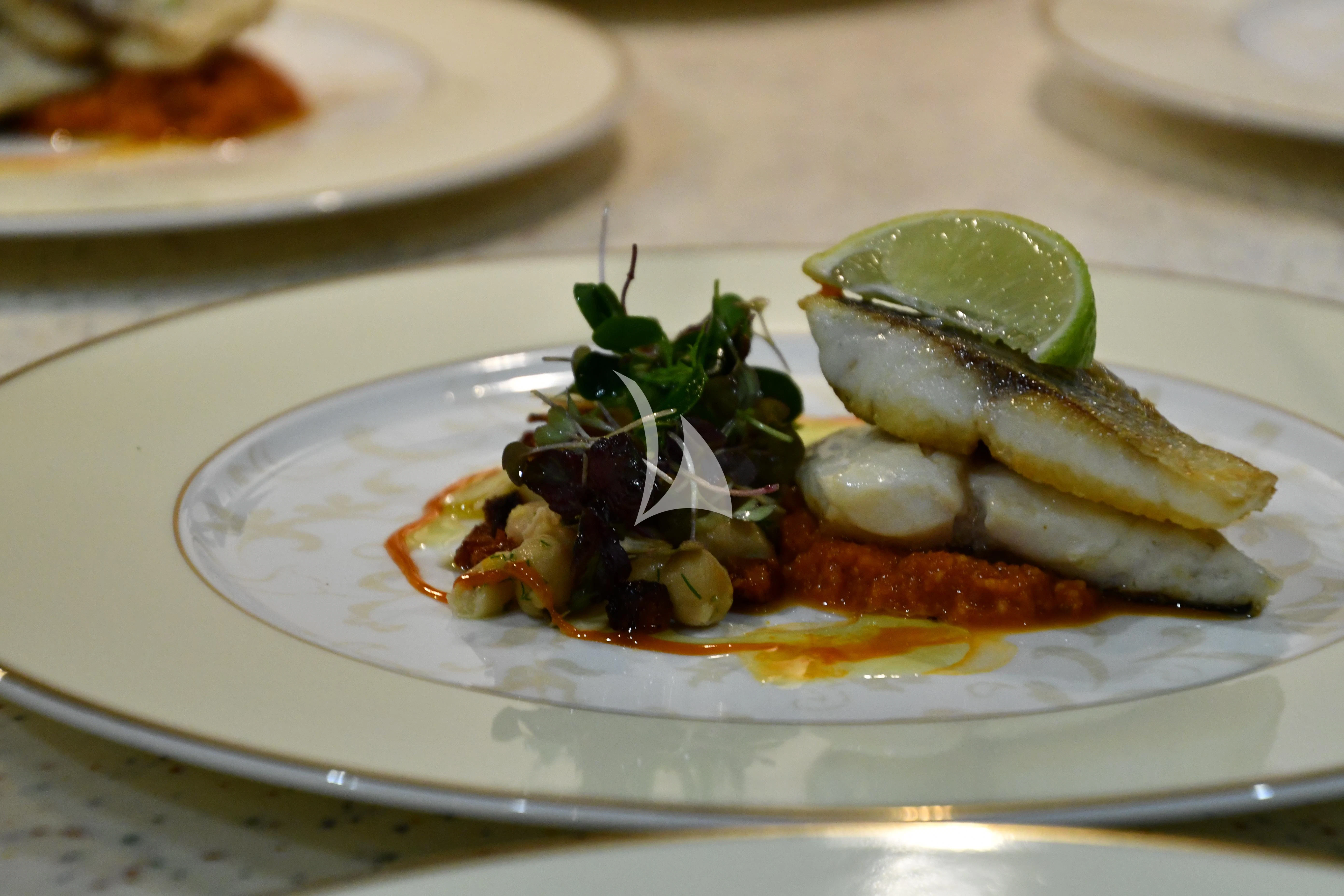 a plate of food aboard GRAND CRU Yacht for Sale