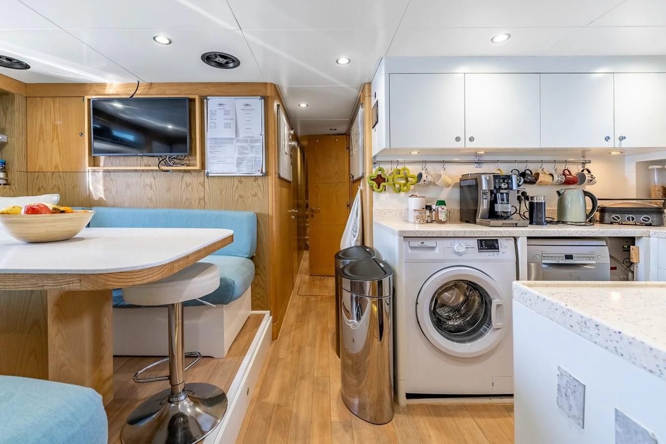 a kitchen with a washing machine aboard GRAND CRU Yacht for Sale