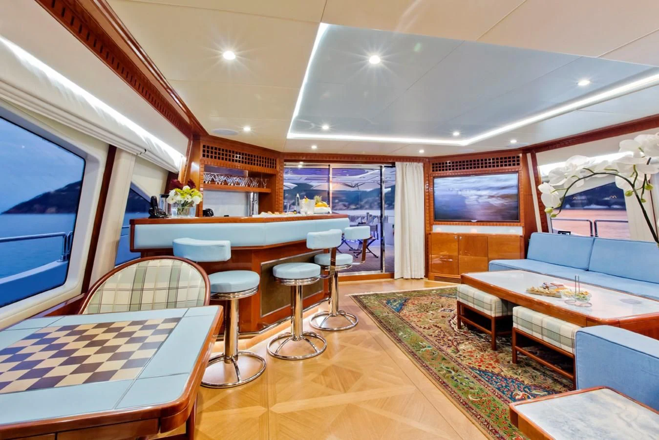 a room with a table and chairs aboard GRAND CRU Yacht for Sale