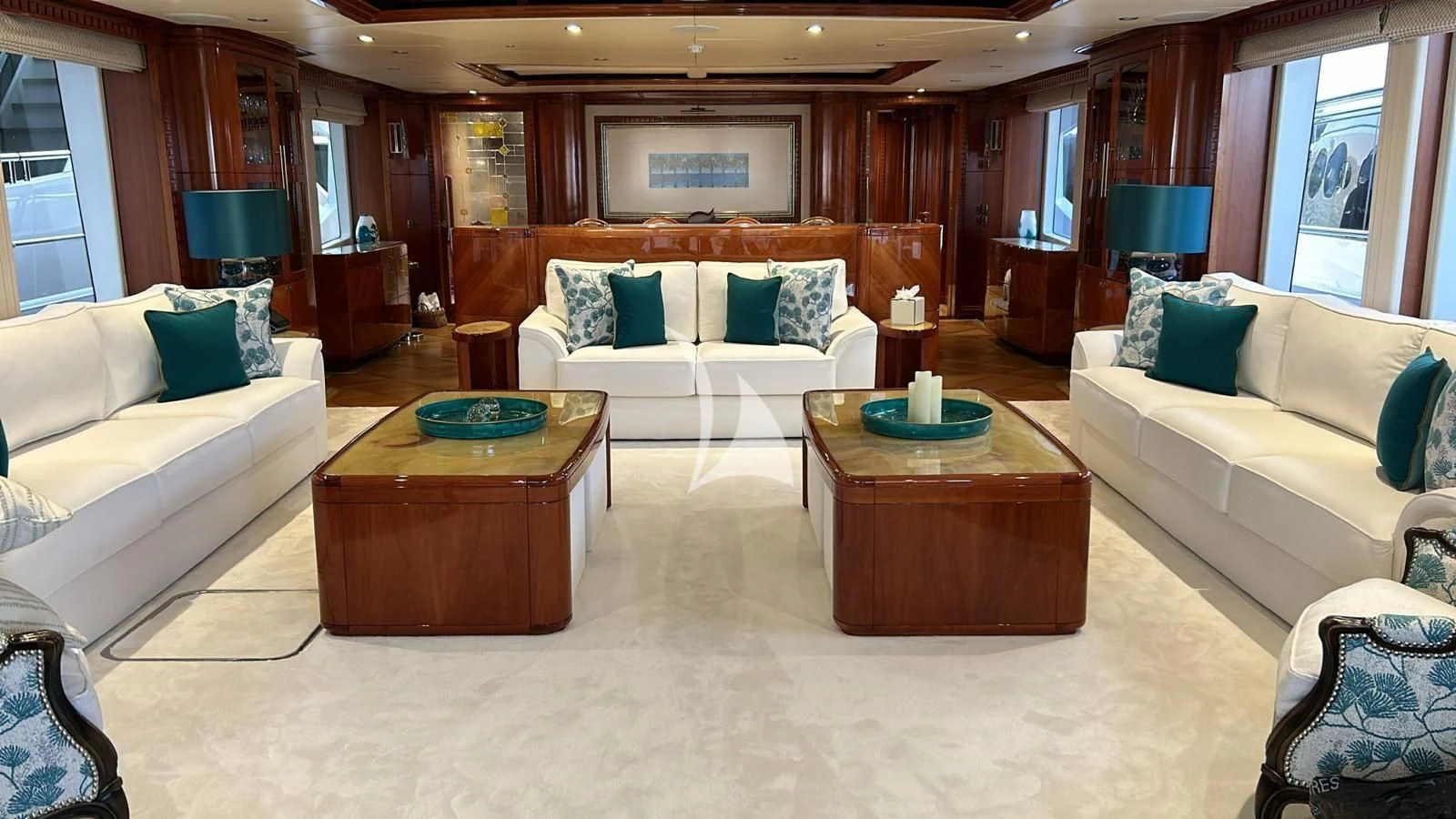 a living room with a couch and a coffee table aboard GRAND CRU Yacht for Sale