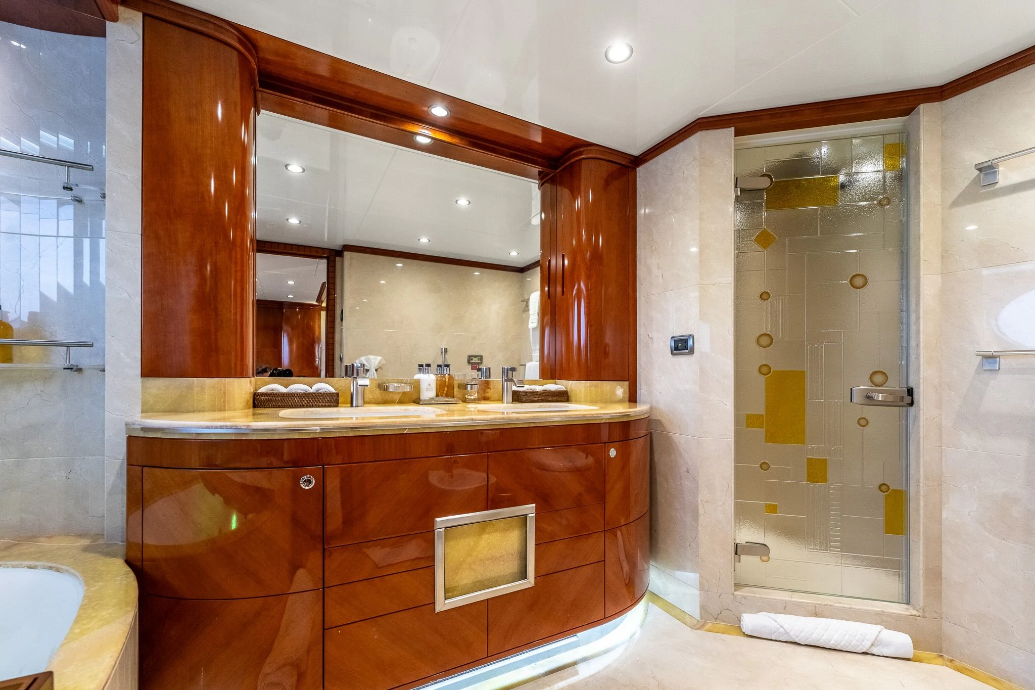 a bathroom with a glass shower aboard GRAND CRU Yacht for Sale