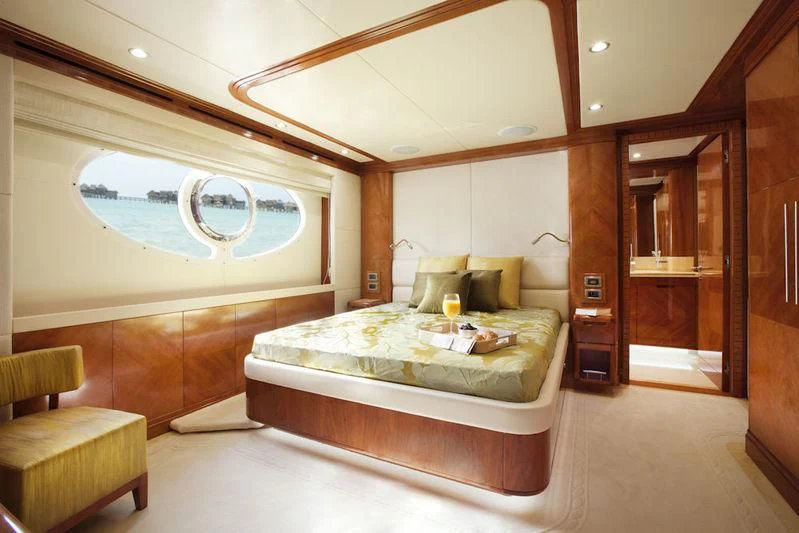 a room with a bed and a window aboard GRAND CRU Yacht for Sale