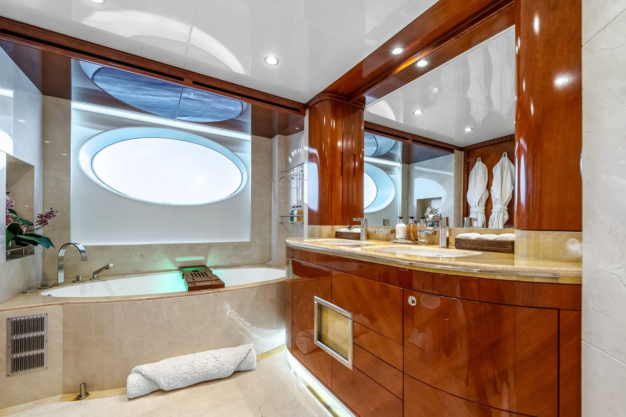 a bathroom with a large mirror aboard GRAND CRU Yacht for Sale