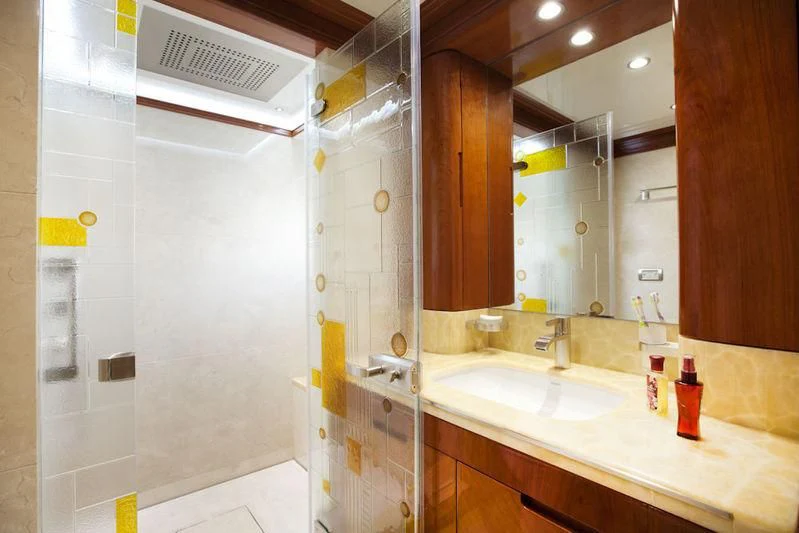 a bathroom with a sink and a mirror aboard GRAND CRU Yacht for Sale