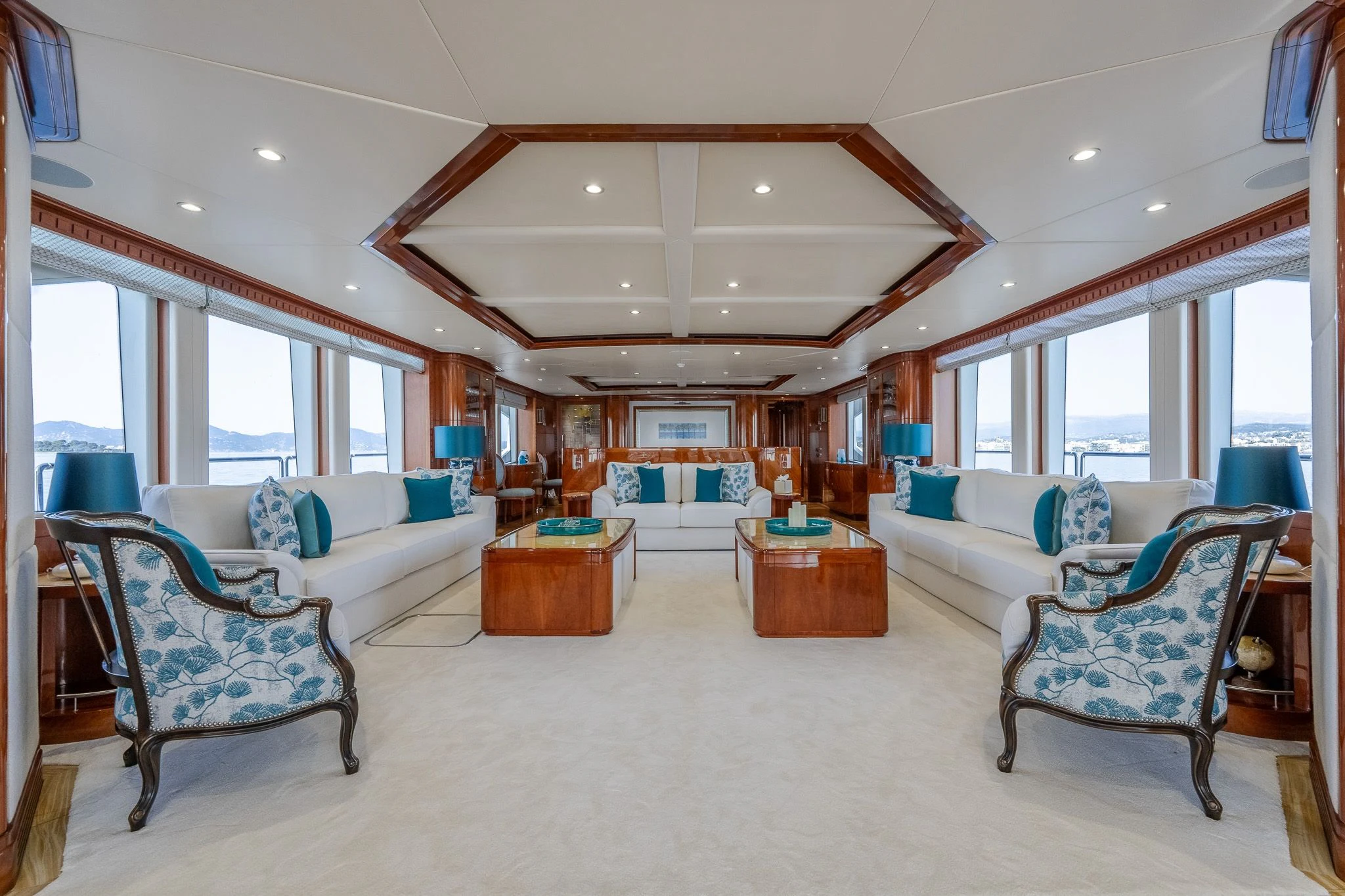 a living room with a large window aboard GRAND CRU Yacht for Sale