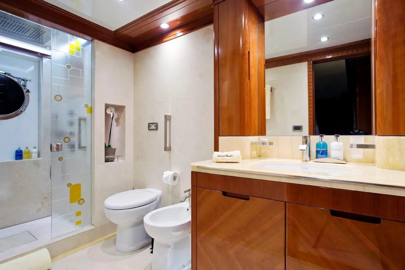 a bathroom with a glass shower aboard GRAND CRU Yacht for Sale