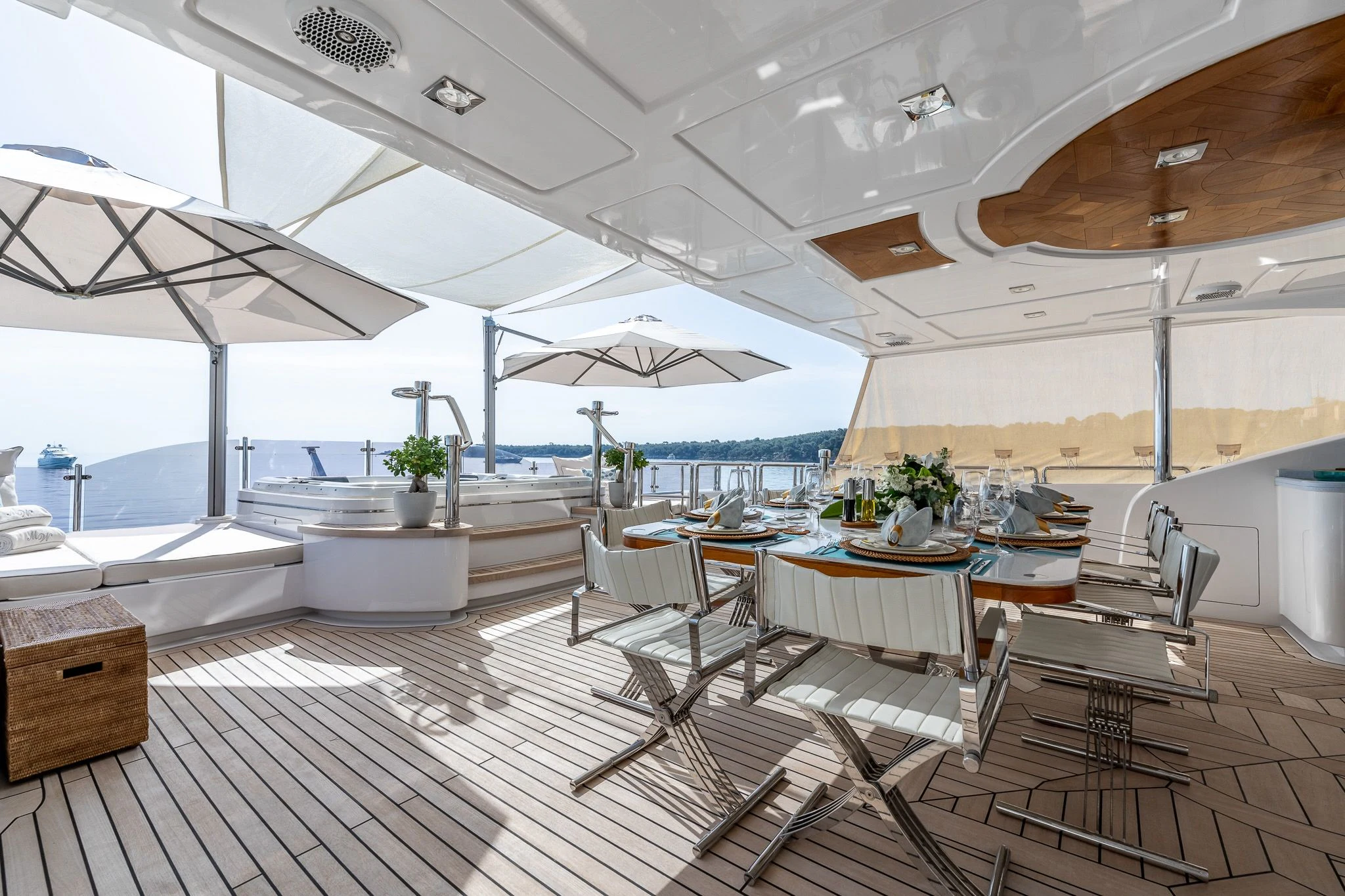 a room with tables and chairs aboard GRAND CRU Yacht for Sale