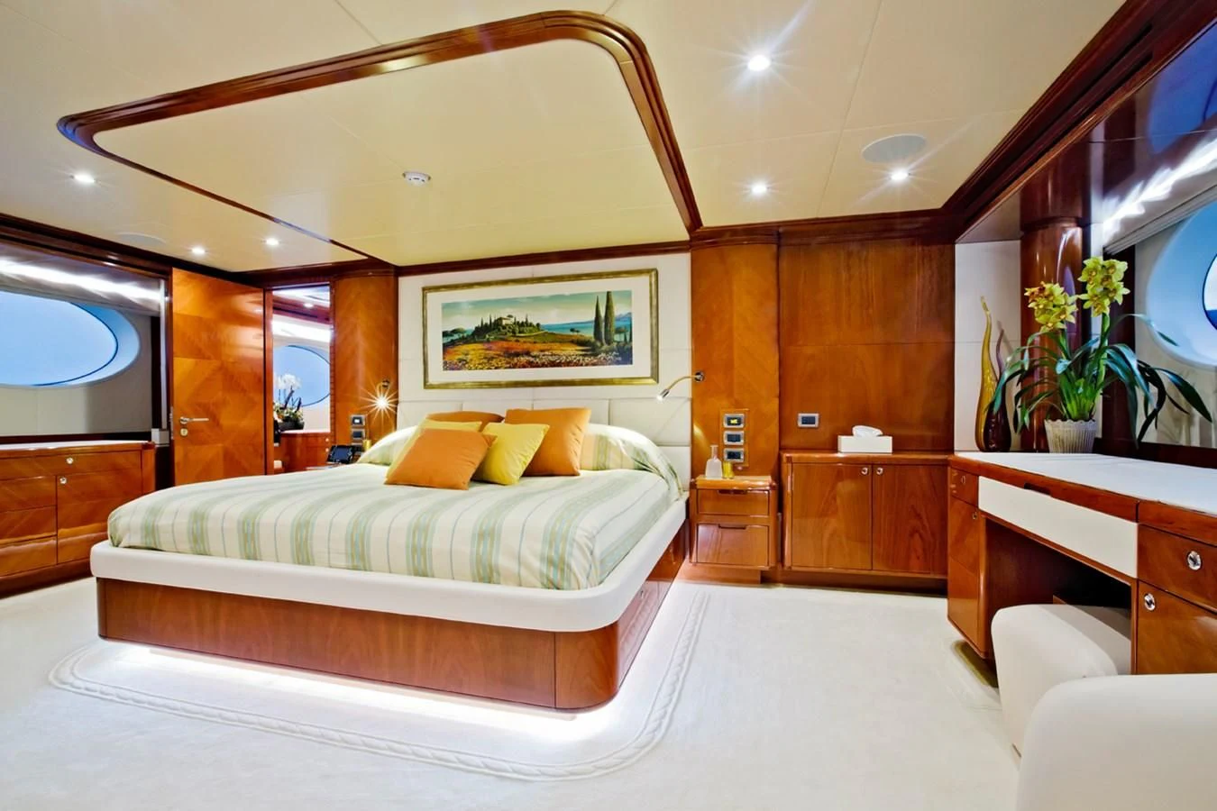 a large bedroom with a large mirror aboard GRAND CRU Yacht for Sale