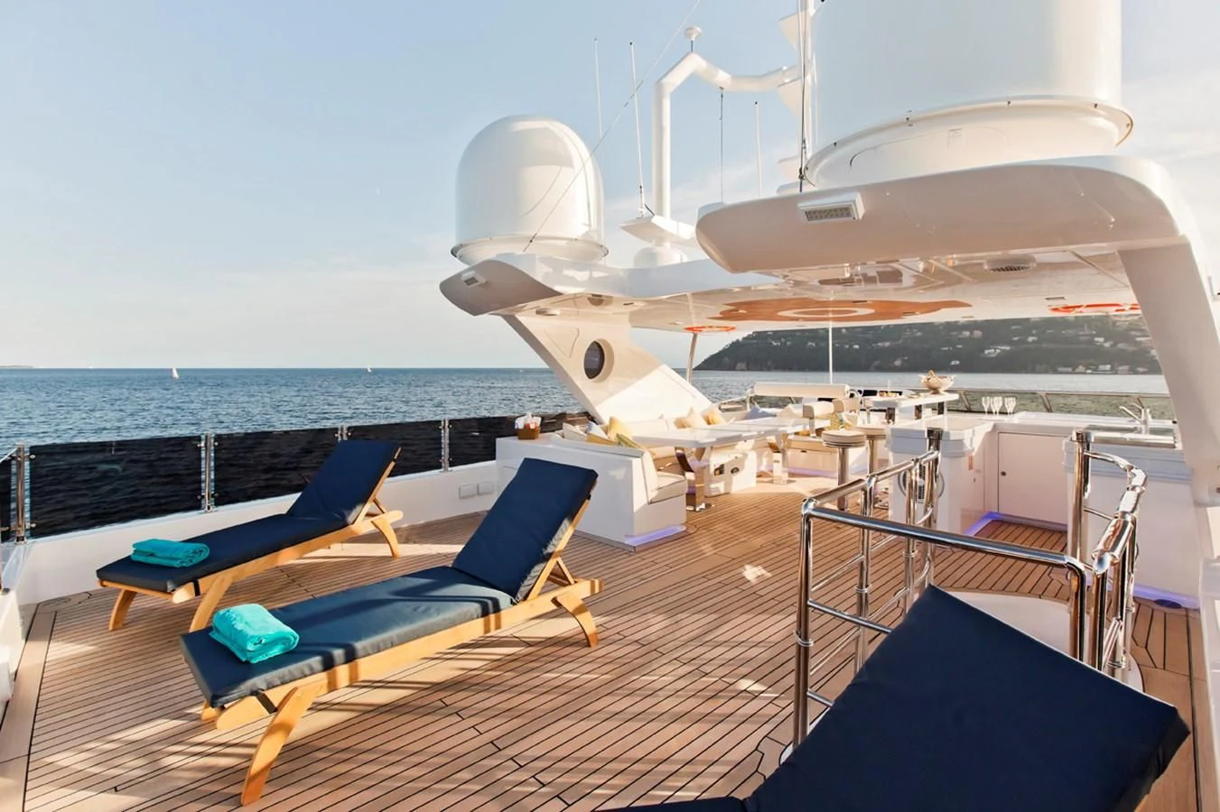 a deck with a couple of jets on it and a large plane in the background aboard GRAND CRU Yacht for Sale