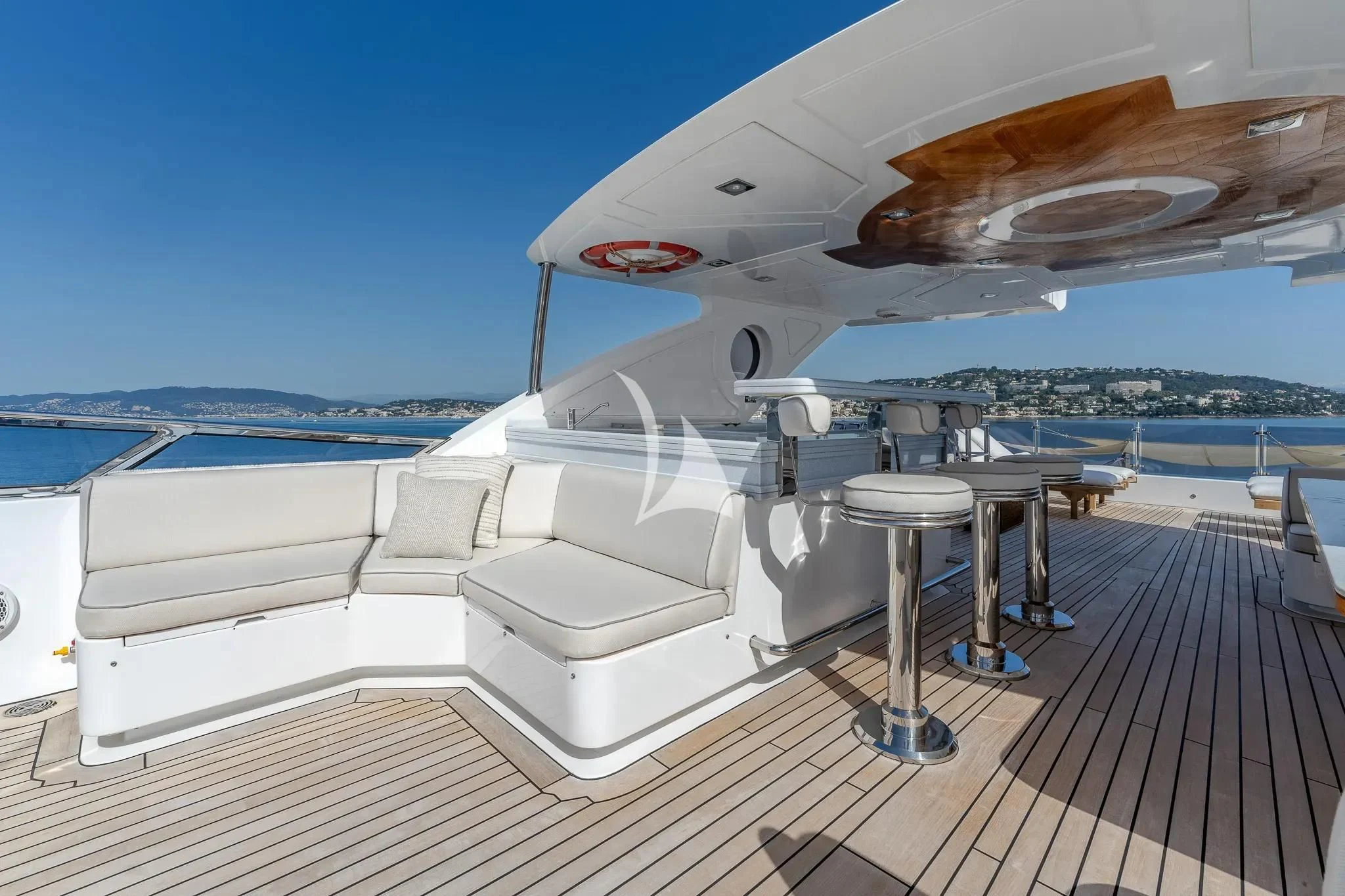 a white yacht on a deck aboard GRAND CRU Yacht for Sale