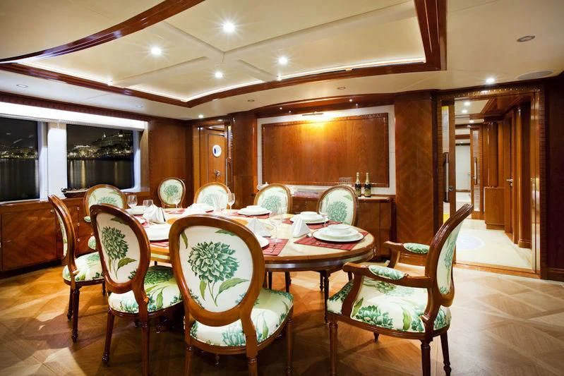 a dining room with a table and chairs aboard GRAND CRU Yacht for Sale