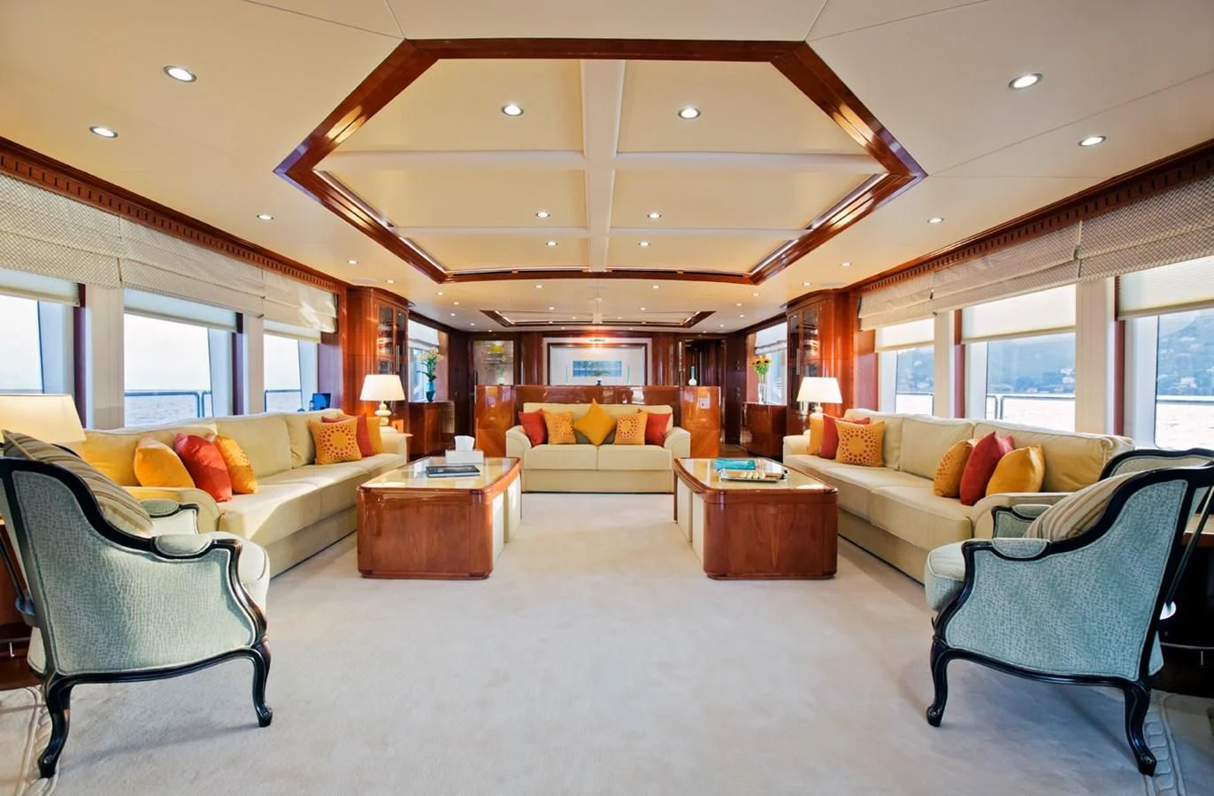 a living room with a couch and a table aboard GRAND CRU Yacht for Sale