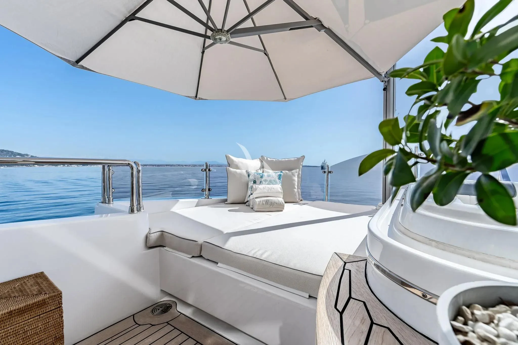 a bathtub with a chair and a plant on the side aboard GRAND CRU Yacht for Sale