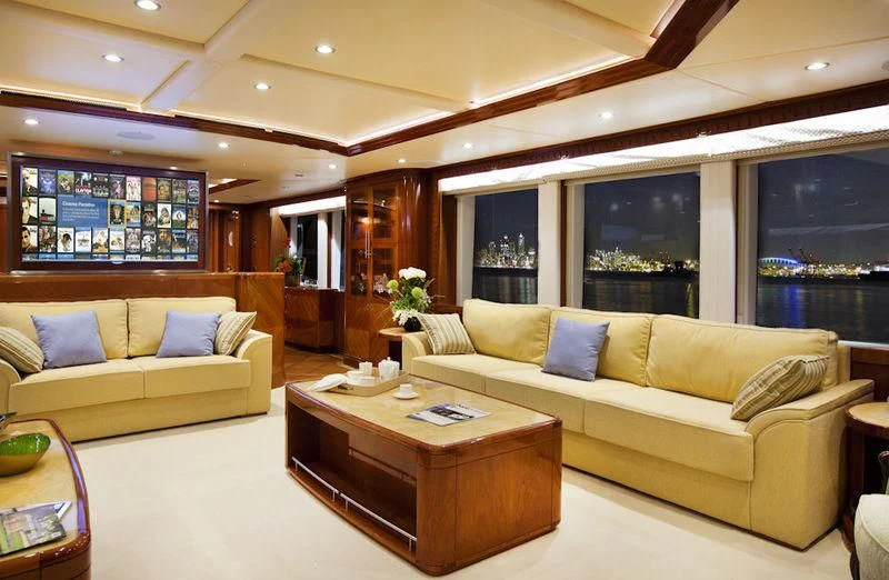 a living room with a couch and coffee table aboard GRAND CRU Yacht for Sale