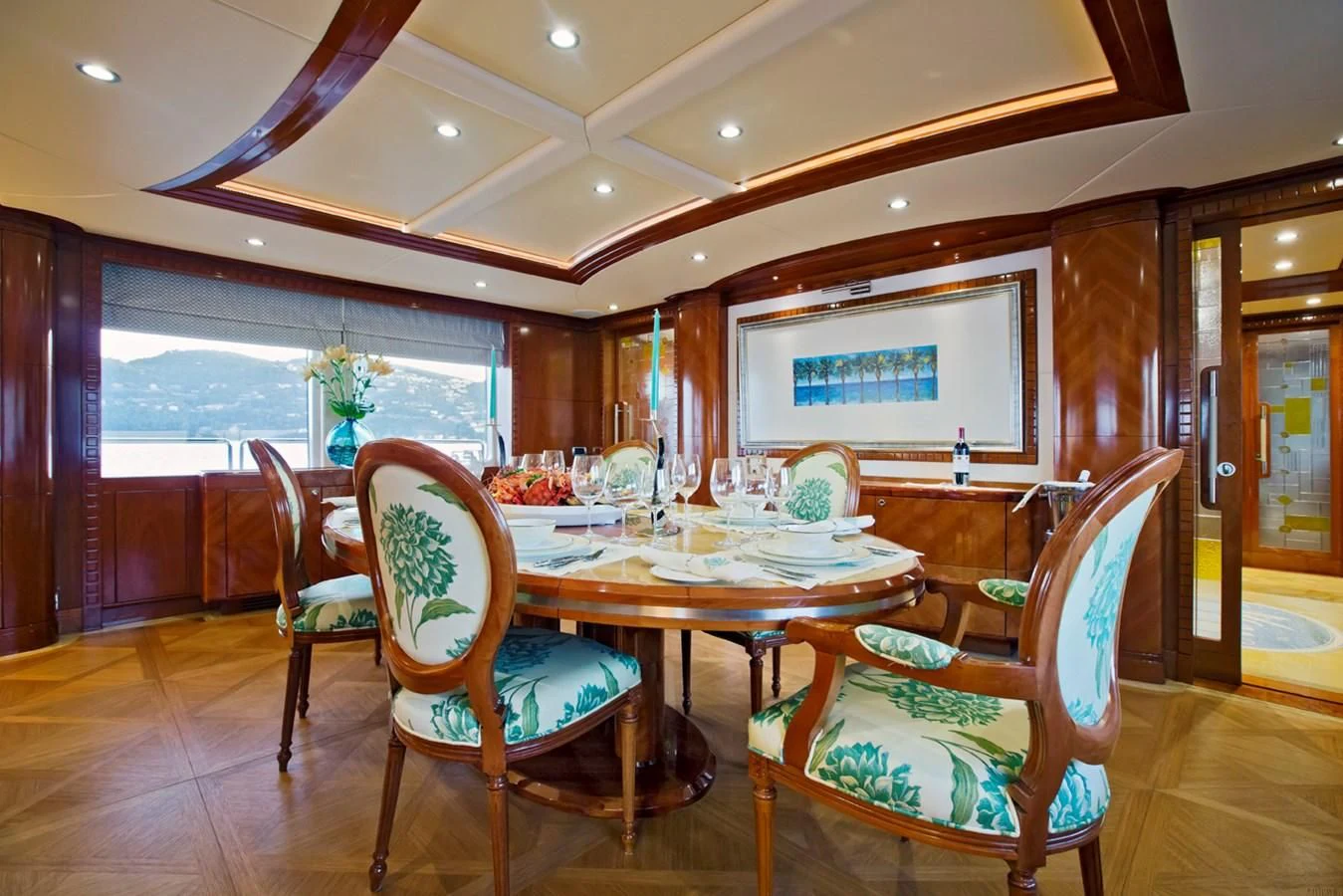 a dining room with a table and chairs aboard GRAND CRU Yacht for Sale