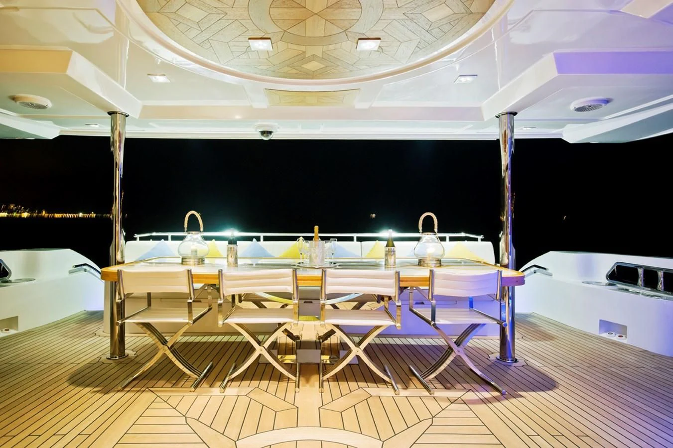 a pool with tables and chairs aboard GRAND CRU Yacht for Sale