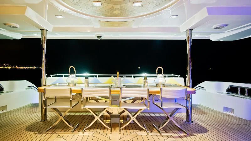 a pool table with chairs aboard GRAND CRU Yacht for Sale