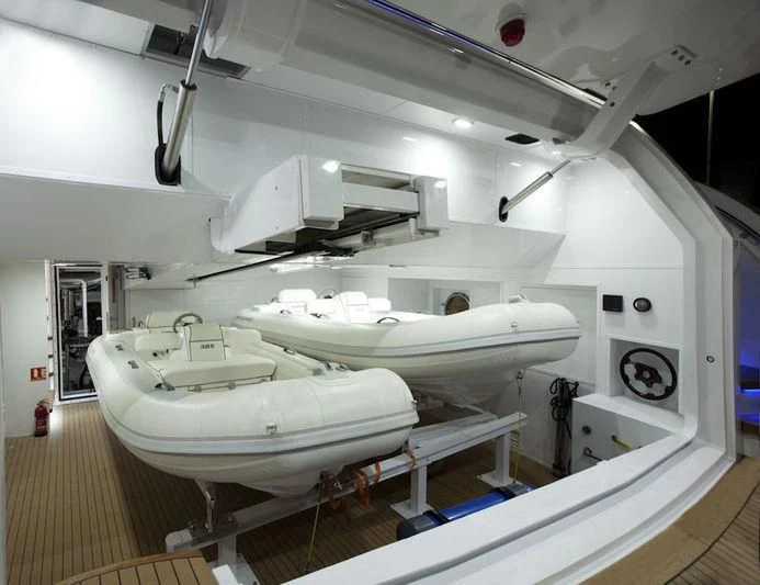 a large white room with a large white tub and sinks aboard GRAND CRU Yacht for Sale