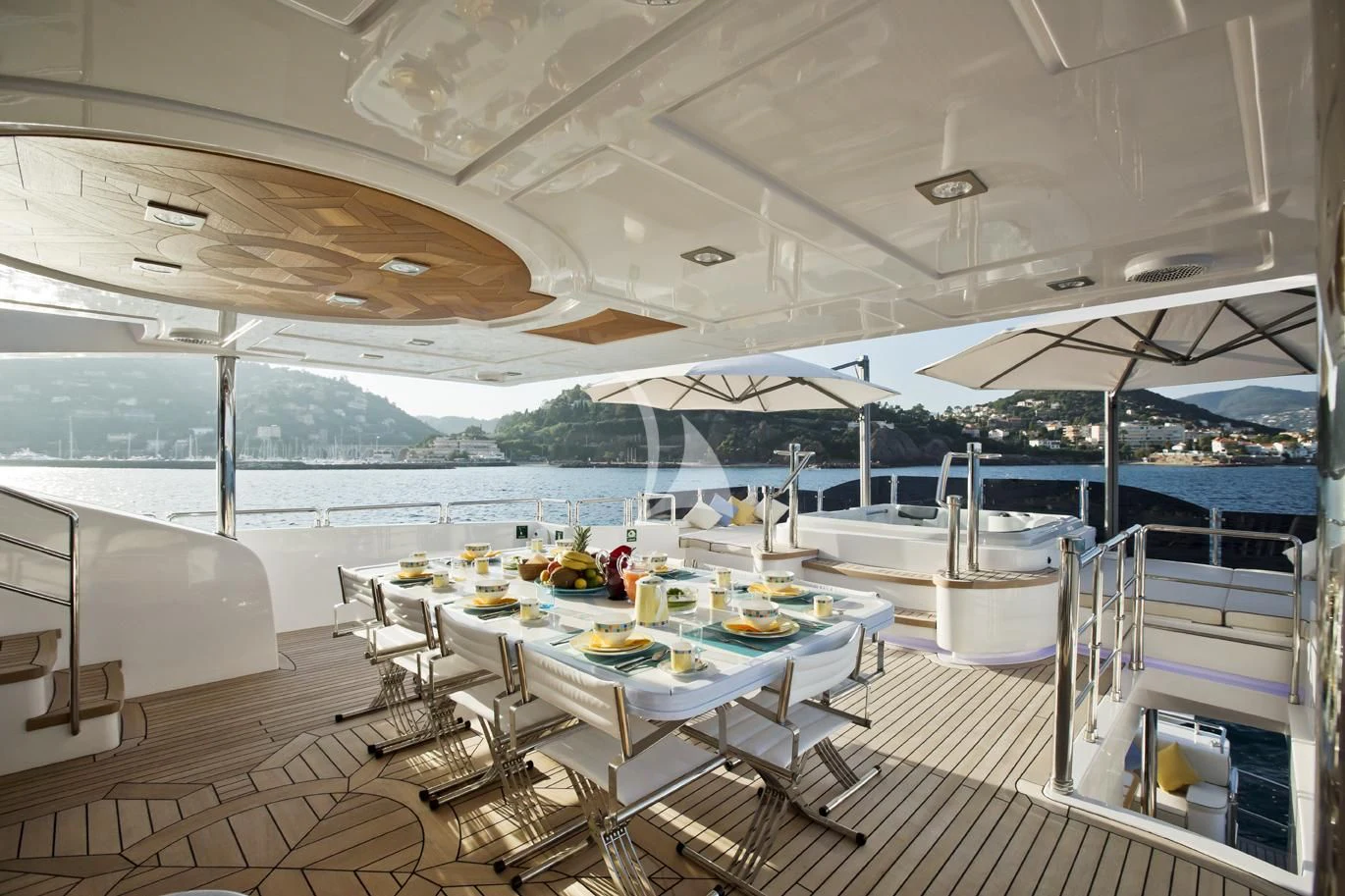 a room with a table and chairs aboard GRAND CRU Yacht for Sale